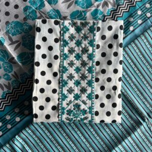 Unstitched Mal Mal cotton suit set with polka dots, floral embroidery, and printed patterns in teal and black, laid out on a table.