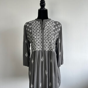 Grey short kurti with white floral embroidery, displayed on a black mannequin.