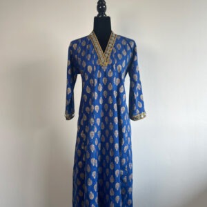 A royal blue long kurti with gold prints and mirror-embellished details, displayed on a black half-body mannequin against a white background