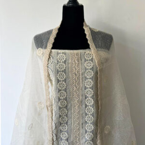 Unstitched 3-piece material set featuring a cream embroidered top with circular threadwork motifs, net dupatta with scattered floral embroidery, displayed on a black mannequin.