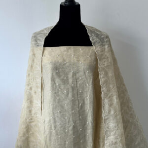 Cream unstitched 3-piece set displayed on a black mannequin, with embroidered kurta top and floral embroidered dupatta.