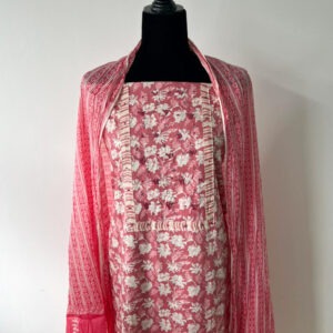 Floral pink unstitched kurta material displayed on a black mannequin with matching dupatta draped over the shoulders.