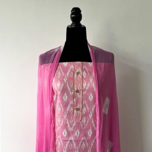Candy pink unstitched set with printed design and chiffon dupatta displayed on mannequin.